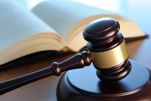 gavel on desk with book