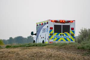 ambulance leaving crash scene