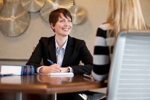 joanna sweet sitting at desk