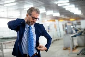 businessman holding hardhat