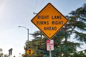 yellow right turn ahead sign