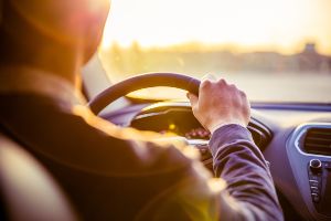 driver at wheel of car