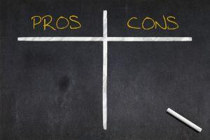 blank pros and cons list on chalkboard