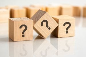 wooden blocks with question marks