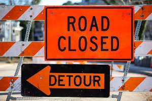 orange road closure sign