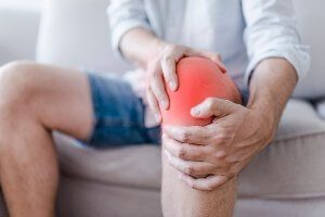 man with painful knee injury