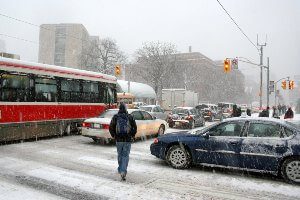 man walking on crosswalk in snow