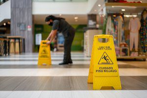 putting wet floor signs down