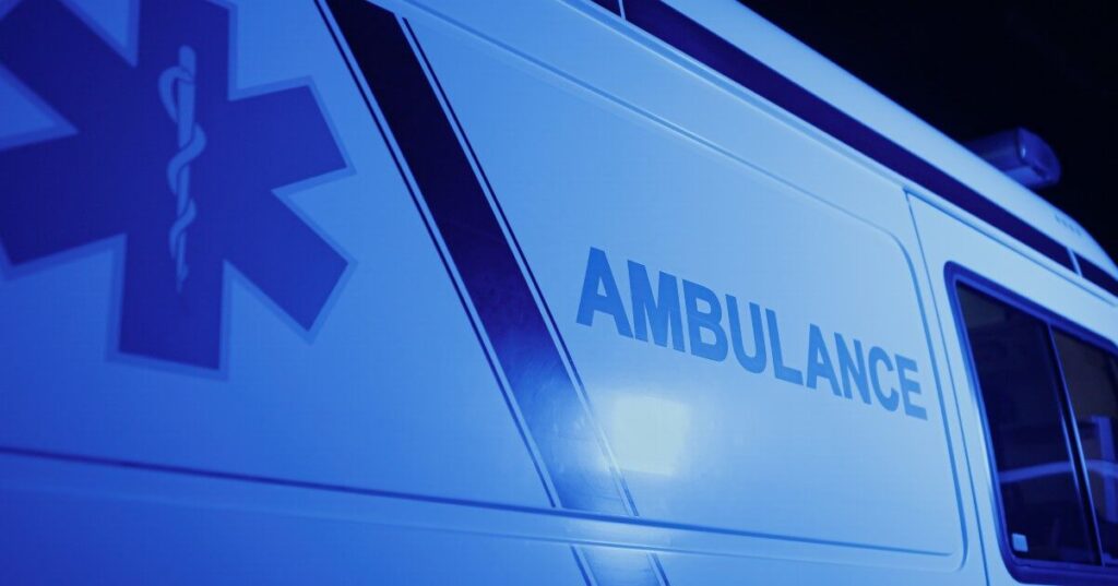 blue light on side of ambulance
