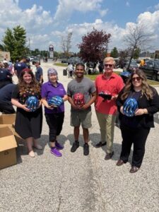 Giving Back: Helmets for Children of Camp Brombal