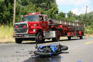 wrecked motorcycle and fire truck