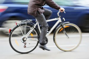 car passing a cyclist