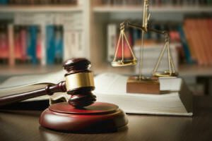 scale with gavel and books
