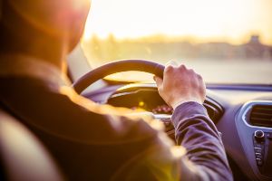 driver at wheel of car