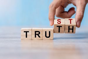 wood blocks with truth and trust written on them