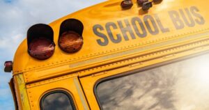 Several Children Injured in Collision Between Car and Small School Bus